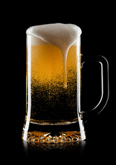 Cold glass of lager beer with foam and bubbles