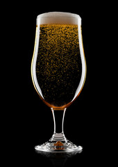 Cold glass of lager beer with foam and bubbles
