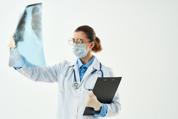 woman in white coat with x-ray