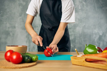 cook in the kitchen preparing food