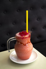 Fresh strawberry smoothie on wooden table