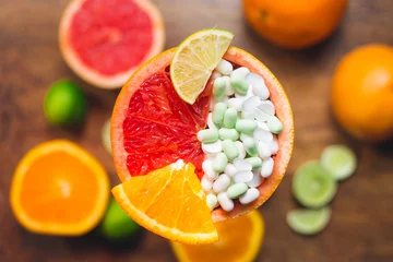 Fotobehang Vitamin C in citruses and supplement. Concept © Yevheniia