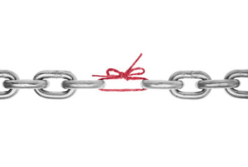 The weak link in the chain -Broken chain with piece of red string holding together, included clipping path