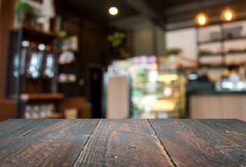 Wood floor, dark brown and background blur inside a cafe.