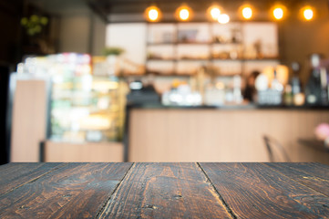 Wood floor, dark brown and background blur inside a cafe.