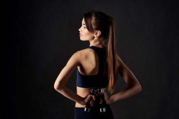 Fototapeta na wymiar fitness woman with dumbbells