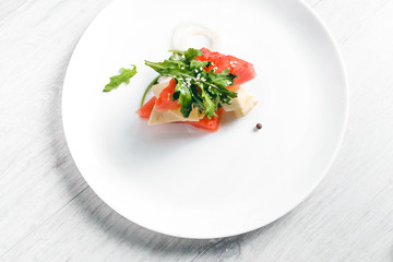 Watermelon salad with goat cheese and arugula