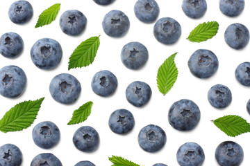 healthy background. blueberries with leaves isolated on white background. top view