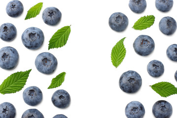 healthy background. blueberries with leaves isolated on white background. top view