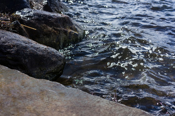 stone shore close up with water
