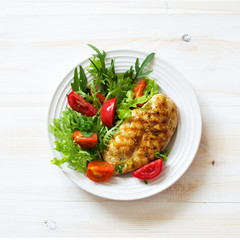 Grilled chicken fillet  and fresh vegetable salad