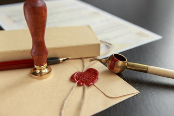 Old notarial wax seal on tied scroll,
