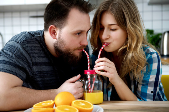 Couple drinking fresh squized orange juice