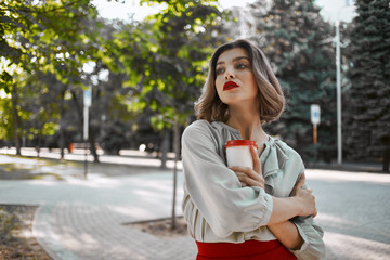 Fototapeta premium woman with coffee in the street