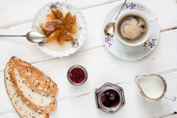 Breakfast with coffee on an old rural table.