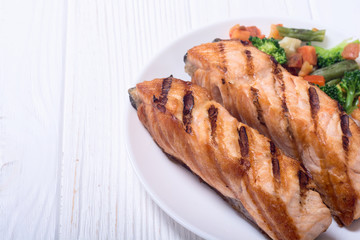 Grilled salmon fish with vegetables