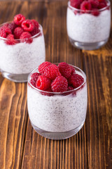 Chia pudding in glass with raspberry