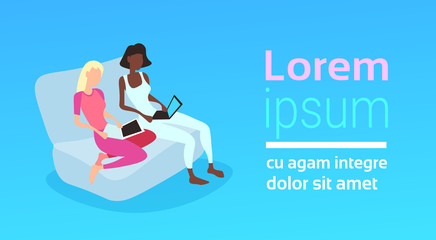 mix race woman couple using laptop sofa relax concept flat blue background horizontal copy space vector illustration