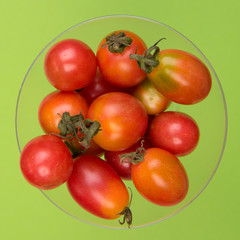 Cherry tomatoes on a colored background