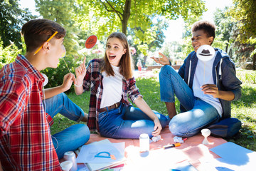 Emotional students. Three students wearing jeans feeling very emotional after achieving their long awaited goal