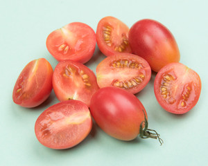 Cherry tomatoes on a colored background