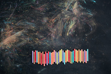 Blackboard with colorful chalk sticks