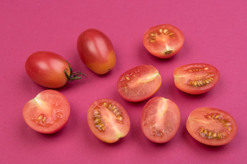 Cherry tomatoes on a colored background