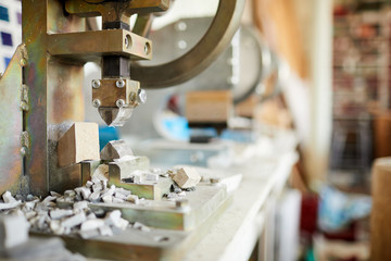 Close up of stone  splitting machine  on table in tile and mosaic workshop, copy space, no people