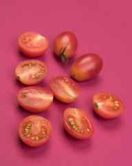 Fototapeta na wymiar Cherry tomatoes on a colored background