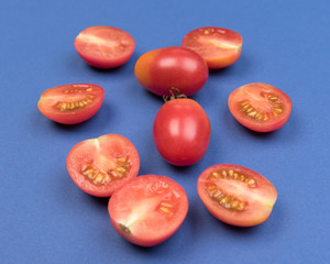 Cherry tomatoes on a colored background