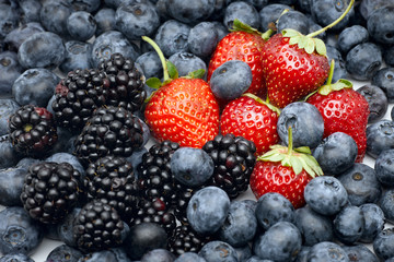 Closeup of strawberries, blackberries and blueberries.