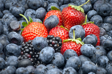 Closeup of strawberries, blackberries and blueberries.