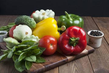 Health food with high fibre. Dietting, whole wheat cerals, grains, vegetables, antioxidants and vitamins: zzuchini, tomatoes, cucumbers, beans. Rustic wooden background.