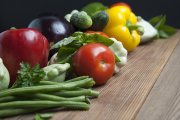 Health food with high fibre. Dietting, whole wheat cerals, grains, vegetables, antioxidants and vitamins: zzuchini, tomatoes, cucumbers, beans. Rustic wooden background.