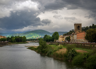 Fototapeta na wymiar View of the Arno River. Bad weather in Florence. Tuscany. Italy.