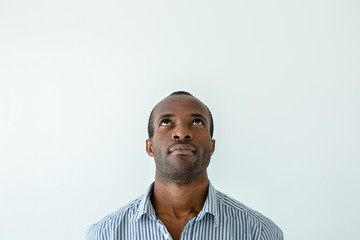 Fototapeta premium Portrait of afro american man looking up