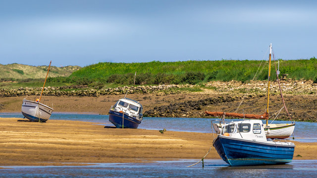 Several boats on the beach at low tide, Burnham Overy Staithe, Norfolk