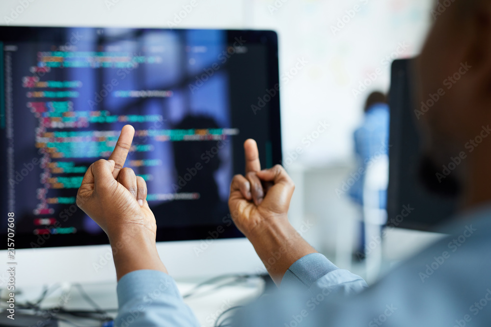 Sticker close-up of unrecognizable african man flipping desktop computer with error off and showing fuck off