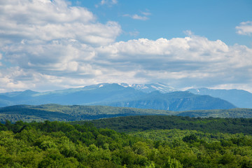 Fototapeta na wymiar Scenic panoramic landscape of a green mountain valley