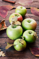 Green Apples on a Wooden Background Autumn Still Life Fallen Leaves