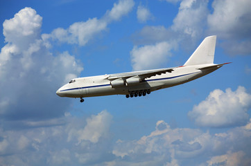 Fototapeta na wymiar Transport airplane in the summer sky