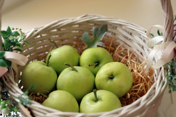 apples in a straw basket just harvested