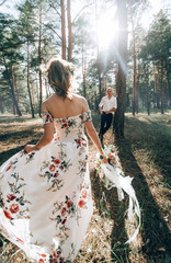 Fototapeta premium bride and groom in the forest