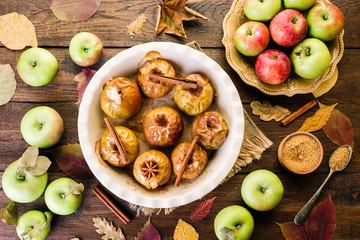 Baked Apples on a Wooden Background Cinnamon Anise and Autumn Leaves