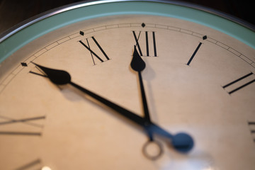 Wall clock showing ten minutes till midnight.
