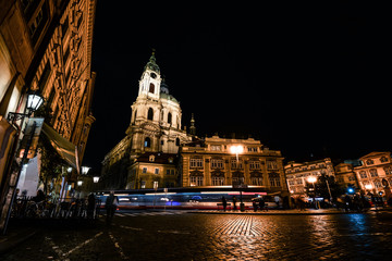 Prague, Czech Republic - October 11, 2017: Night view on ancient Church of Saint Nicholas is a Baroque church in the Lesser Town of Prague, Czech Republic