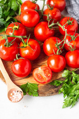 Cherry tomatoes with herbs (parsley), salt and pepper. Organic food. Ingredients for preparation tomato juice or soup (gazpacho).