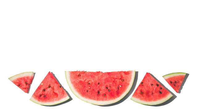 Watermelon background. Top view of watermelon slices isolated on white background. Copy space for text. Banner. Hard light