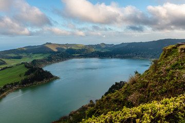 Beautiful landscape with volcanic lake and forest surrounding in Furnas Azores, Portugal