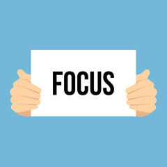 Man showing paper FOCUS text 